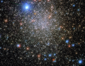 This photo shows a cluster of stars, with many different colors and brightnesses.