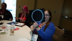 A participant of the Daytime Astronomy session displays their Eclipse Chalk Art 