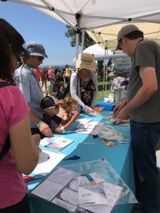 Street fair outreach event with both a STEAM activity booth and a promotional materials booth